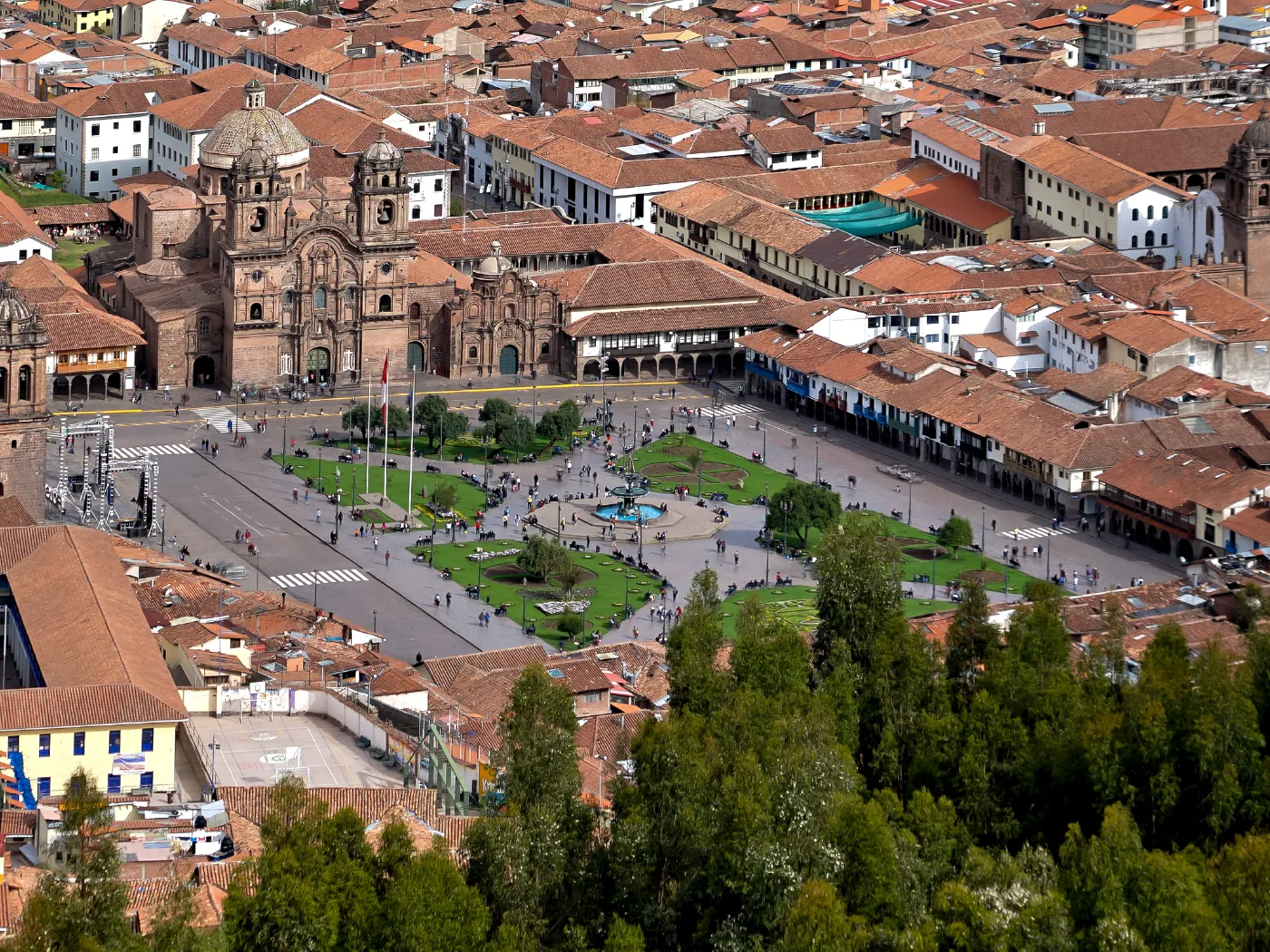 Cusco Plaza de Armas: The vibrant heart of the Imperial City. Panoramic view of Cusco Main Square showing the Cathedral and colonial arches at sunset.