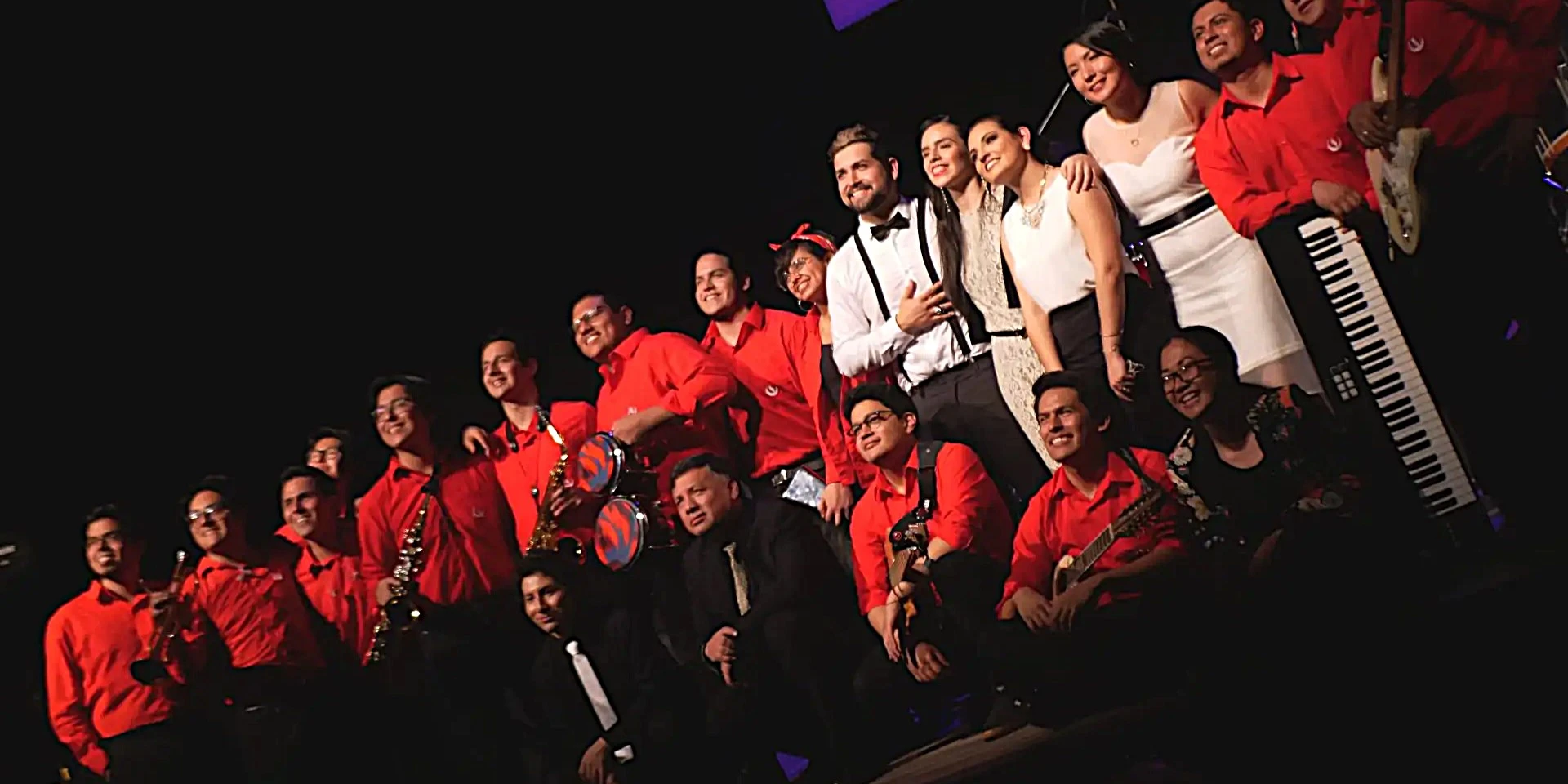 Group of cheerful Peruvian musicians after performing one of their singles.