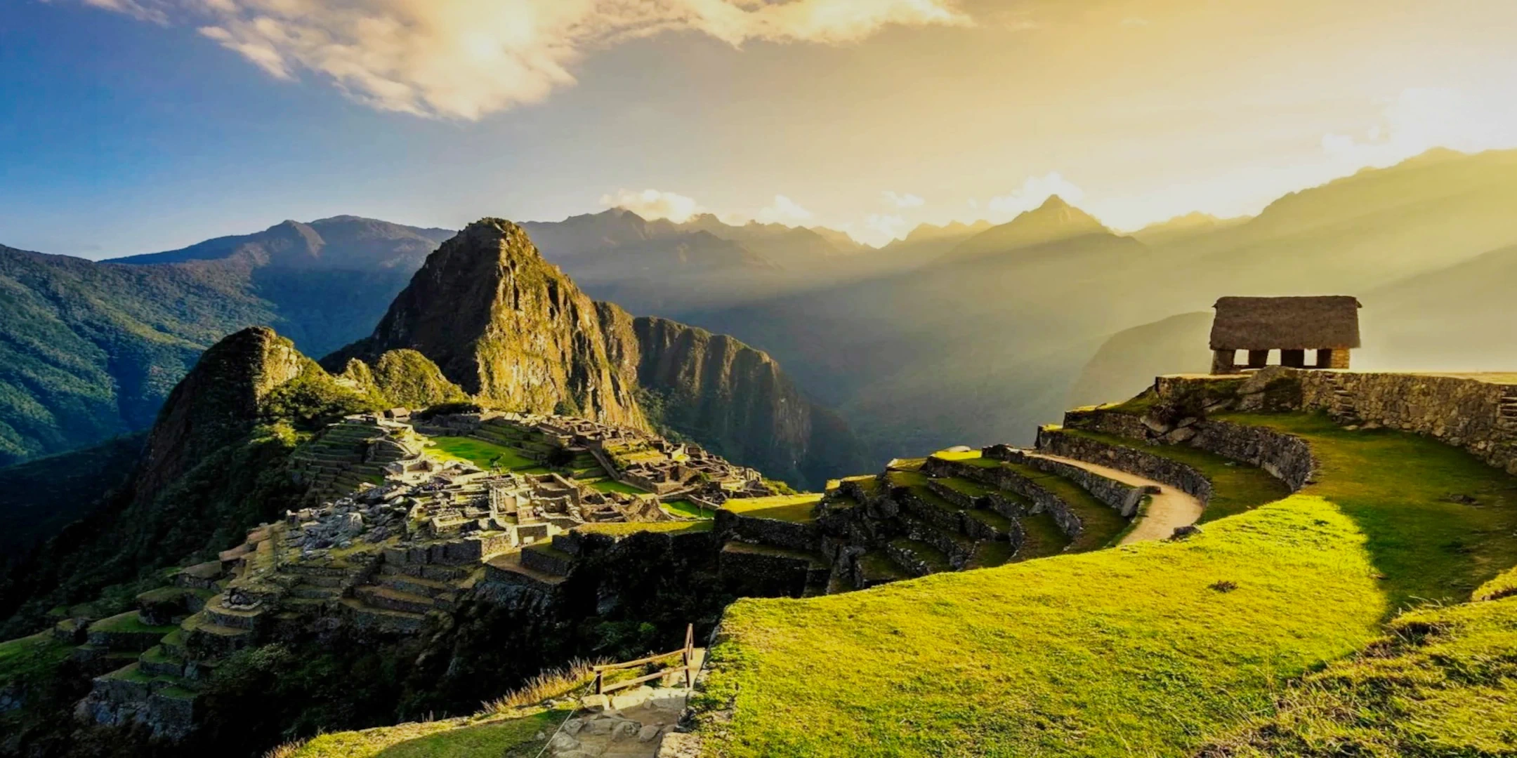 Dramatic sunset view over the Machu Picchu ruins with the Guardhouse on the right side