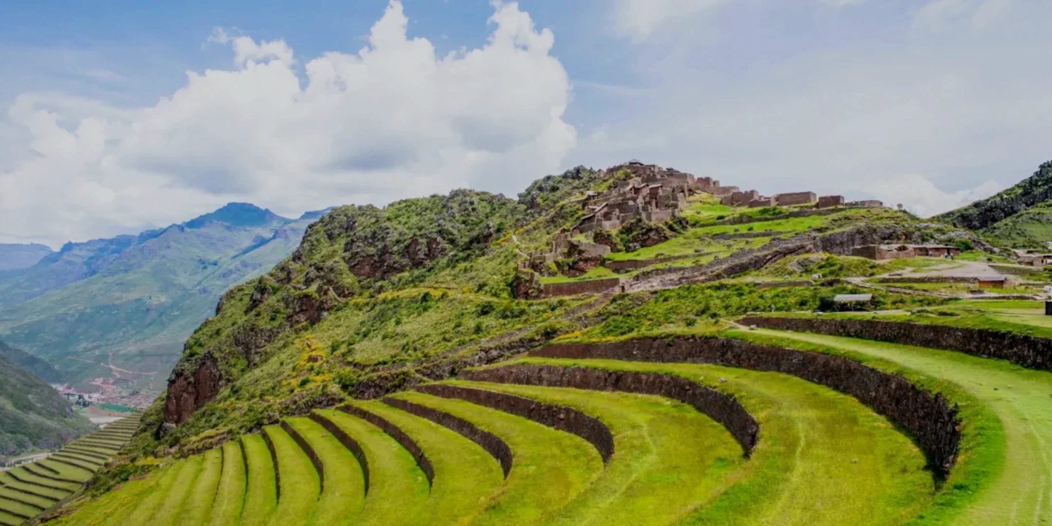 Ancient circular agricultural terraces and stone ruins at the Pisac archaeological site in the Sacred Valley of the Incas.