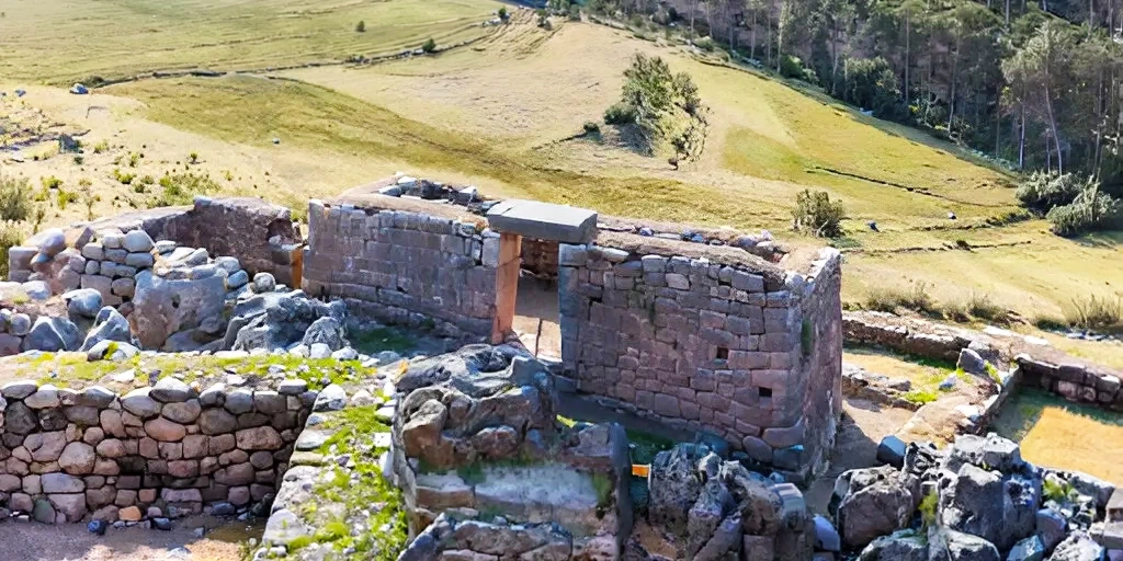 Stone walls and entrance of the Puca Pucara archaeological site in Cusco.