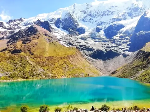 Humantay Lake Glacial Lagoon Turquoise Humantay Lake at the foot of a snow-capped Andean mountain in Peru.