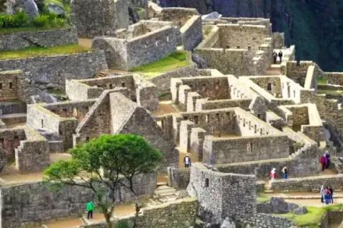 View of the stone structures and residential quarters within the Machu Picchu citadel.