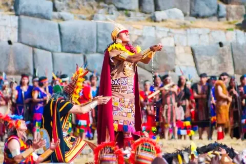 The Sapa Inca holding a golden cup during a traditional offering ritual to the Sun God.