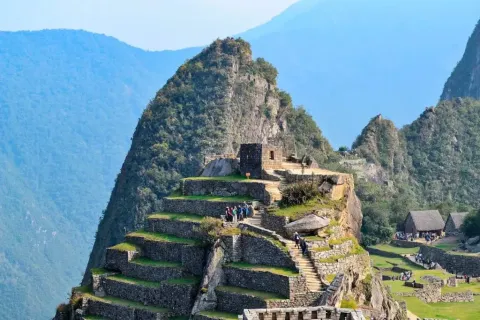 Panoramic view of the Intihuatana pyramid in Machu Picchu, the Inca sundial Intihuatana hill and agricultural terraces in the Inca citadel of Machu Picchu, Peru