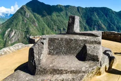 Explore the sacred area of the Intihuatana in Machu Picchu Intihuatana stone on its hill within the Inca citadel of Machu Picchu, Peru