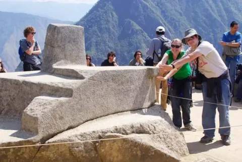 Feel the energy of the Intihuatana: The most enigmatic point of the citadel Sacred monolith of the Intihuatana, center of mystical energy in the ruins of Machu Picchu