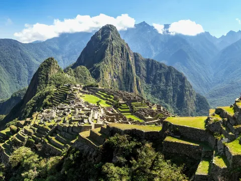 Iconic aerial view of the citadel of Machu Picchu and the Huayna Picchu mountain, enveloped in clouds