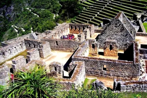 Close-up view of the ancient stone structures and agricultural terraces at the Machu Picchu citadel in Peru.