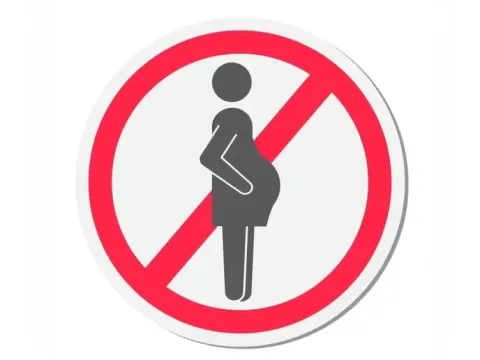 Red prohibition sign over a pregnant woman icon, indicating medical warning