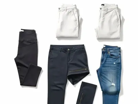 Variety of travel pants: black leggings, navy convertible pants, and classic jeans
