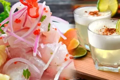 A close-up of fresh fish ceviche paired with two glasses of Pisco Sour cocktail.
