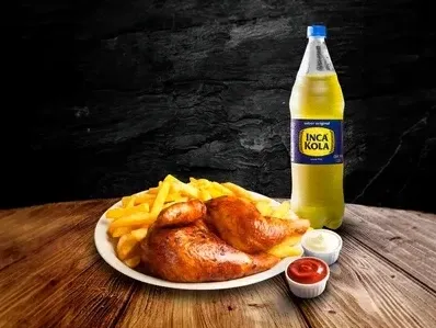 Roasted chicken with french fries served with dipping sauces and a bottle of Inca Kola.