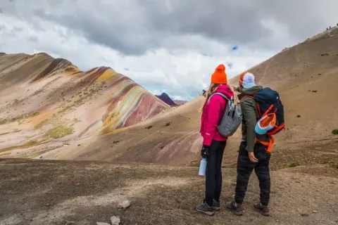 Spectacular view of the Vinicunca Seven Colors Mountain in Cusco, Peru, with red, green, and yellow mineral streaks