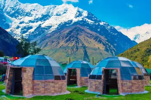 Luxury glass sky domes at Soraypampa campsite with the Humantay mountain in the background.