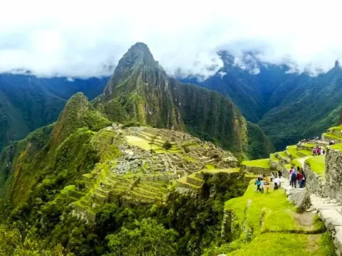 Iconic view of the Inca citadel of Machu Picchu with the steep Huayna Picchu mountain in the background
