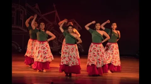 Traditional dance performed by women wearing colorful costumes. 
