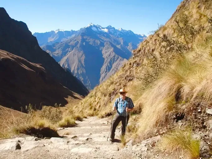 Dead Woman's Pass - Inca Trail A hiker with walking sticks on the stone trail of Abra Warmiwañusca (Dead Woman's Pass).