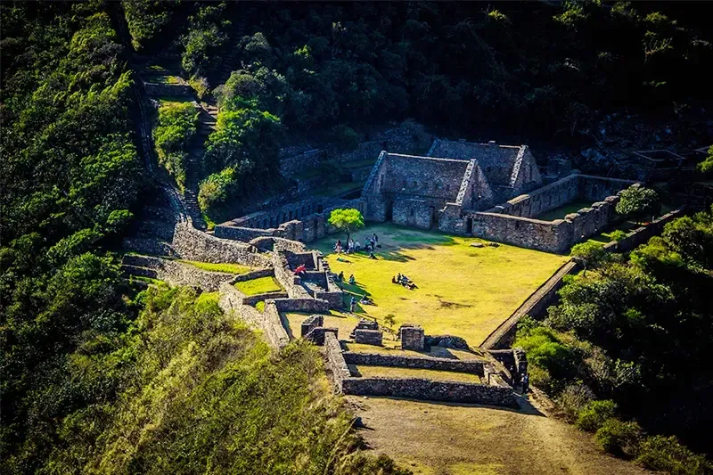 High-angle perspective of the central buildings and terraces of the Choquequirao citadel, emphasizing its remote and dramatic location.