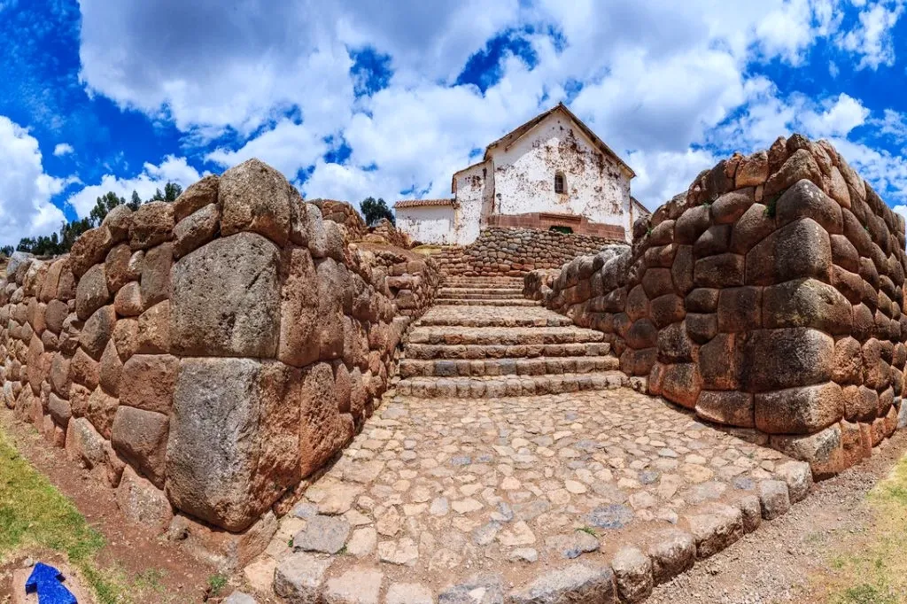 Detailed view of ancient Inca stone stairs leading to the colonial church in Chinchero