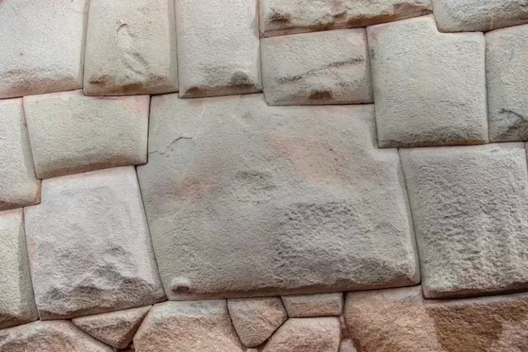 Detailed view of perfectly fitted Inca stones without mortar, showing ancient engineering precision.