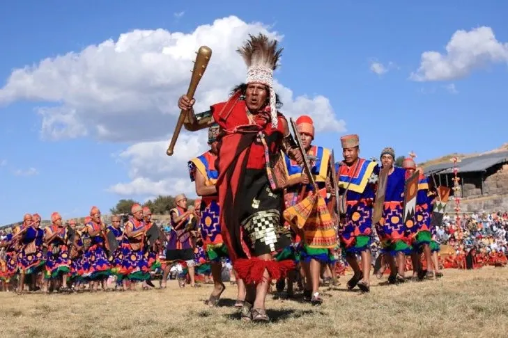 An Incan general leading a group of warriors across the esplanade during the Festival of the Sun.