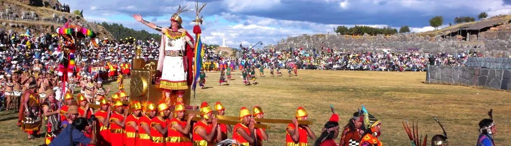A grand celebration of Inti Raymi, the Festival of the Sun, at Sacsayhuaman with performers in Inca royal costumes.