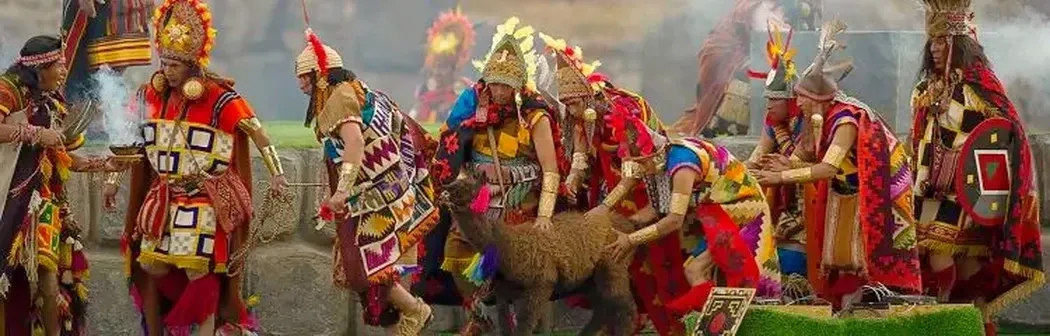 Inca priests performing a traditional ritual sacrifice ceremony with a llama during Inti Raymi.