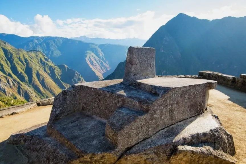 Sacred Intihuatana Stone in Machu Picchu The sacred Intihuatana stone at Machu Picchu, an ancient Inca sundial used for astronomical observations, with the Andean mountain range in the background.