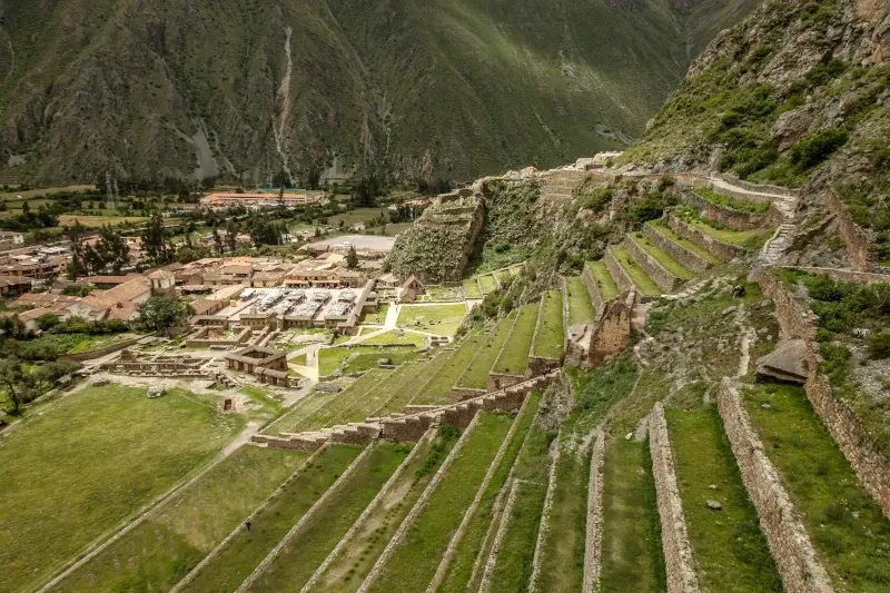 The impressive stone terraces of the Ollantaytambo Inca fortress overlooking the modern town and valley.