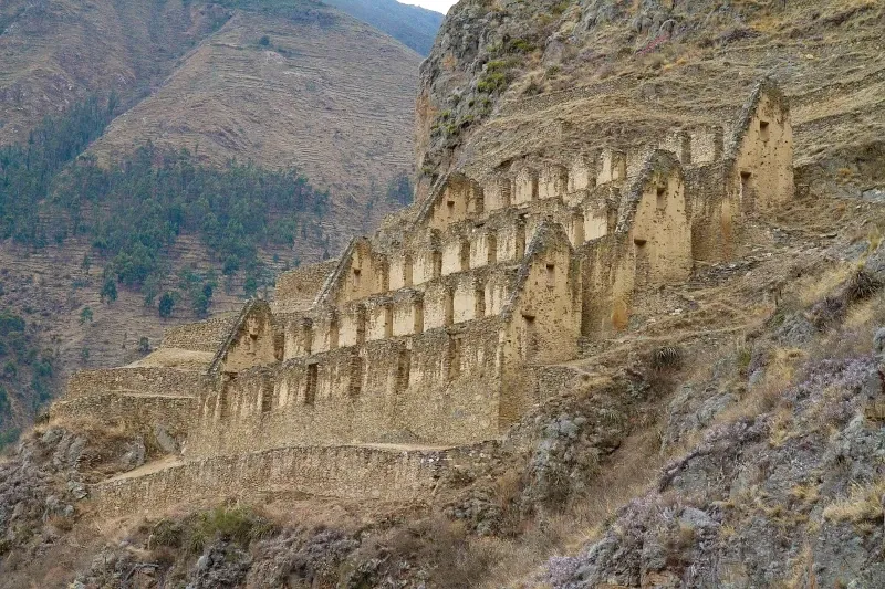 Ancient Inca granaries and storehouses known as Pinkuylluna built into the mountainside overlooking Ollantaytambo.