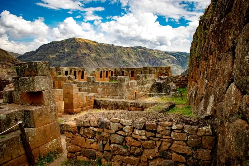 Detailed view of the stone masonry and religious buildings at the Pisac archaeological site in the Sacred Valley.