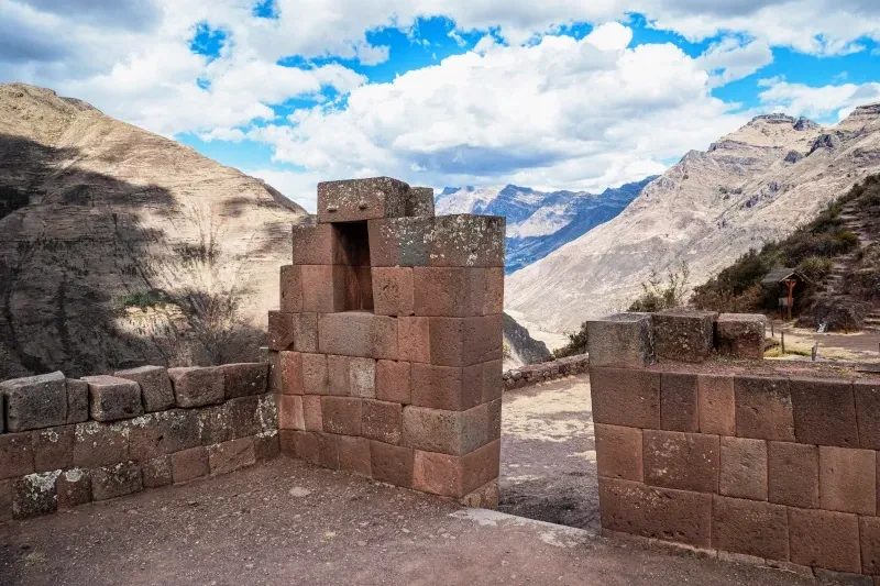 Scenic Views from Pisac Ruins Ancient Incan stone ruins and a doorway overlooking the mountains of the Sacred Valley in Pisac.
