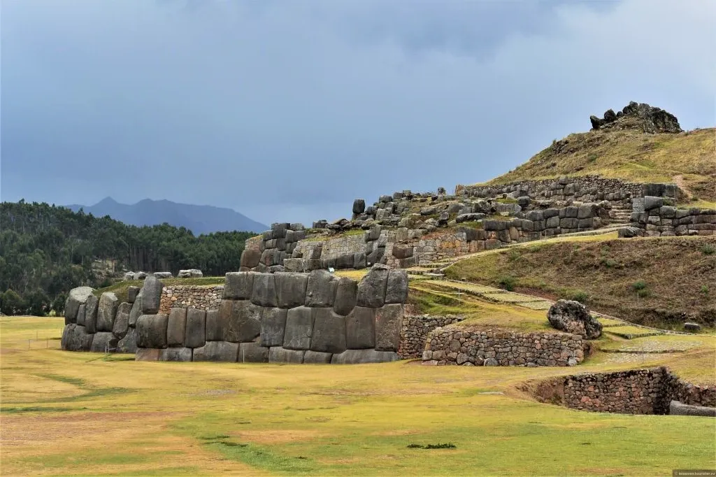 The stone amphitheater and zig-zagging ruins of Qenqo archaeological site near Cusco.