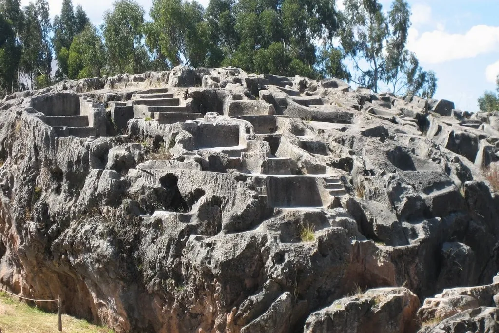 Detailed view of the intricate stone carvings and altars at the Qenqo holy site.
