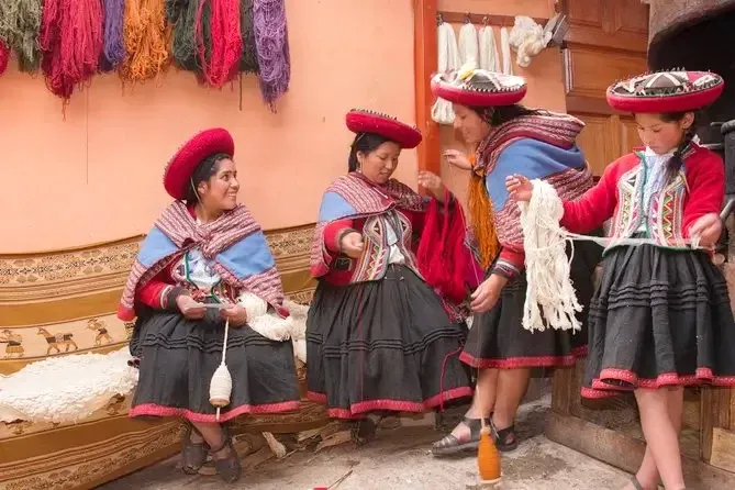 Local women in the Sacred Valley teaching the traditional process of hand-weaving and natural dyeing of textiles.
