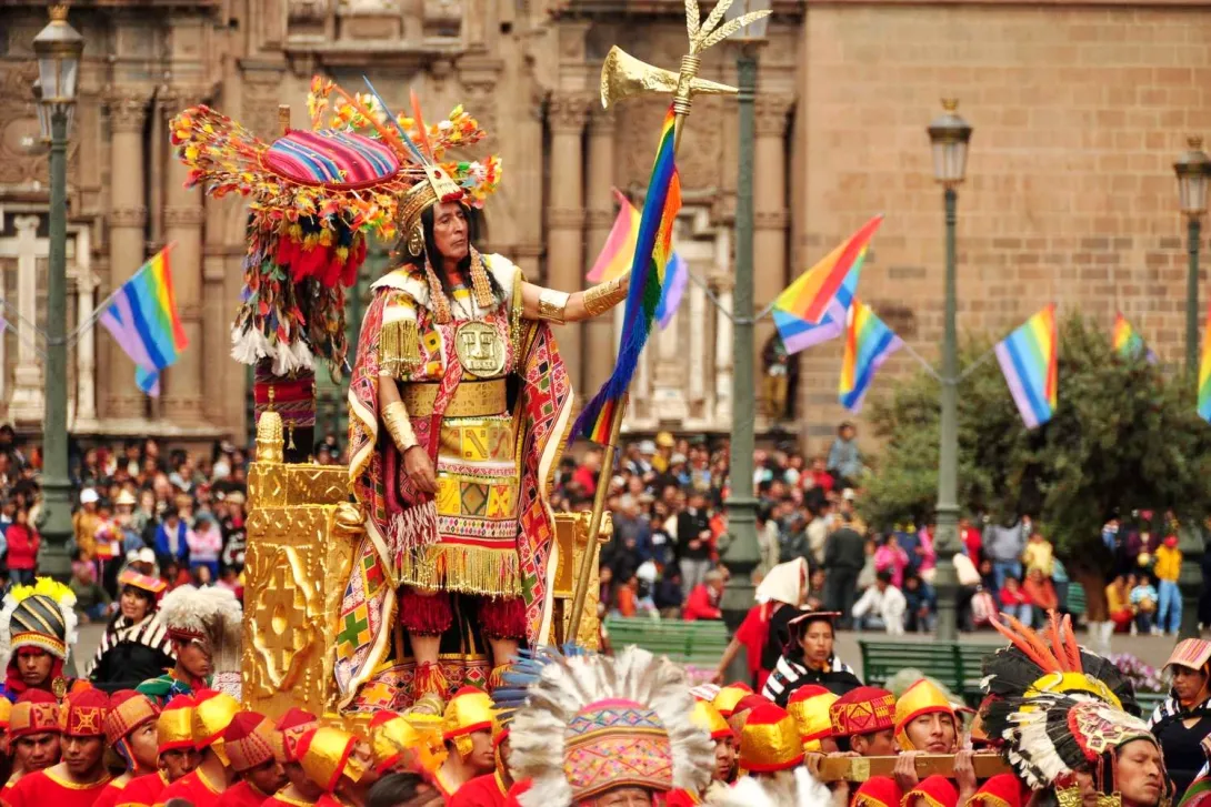 The Sapa Inca carried on a golden litter in front of the Cusco Cathedral during the start of Inti Raymi.