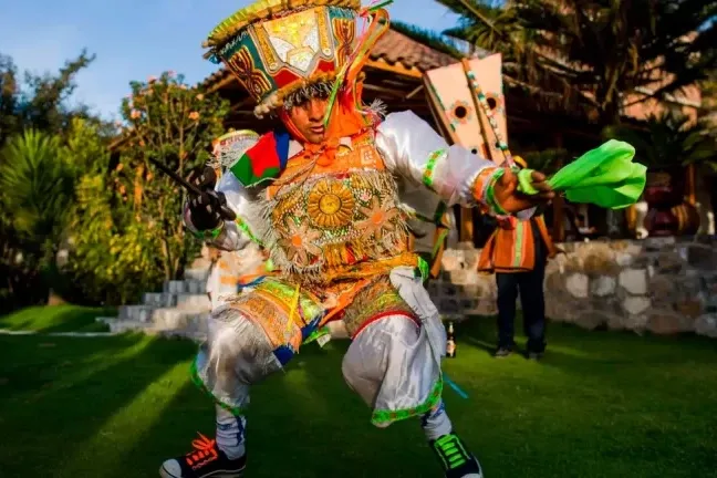Traditional Peruvian Scissors Dancer performing in a colorful costume.