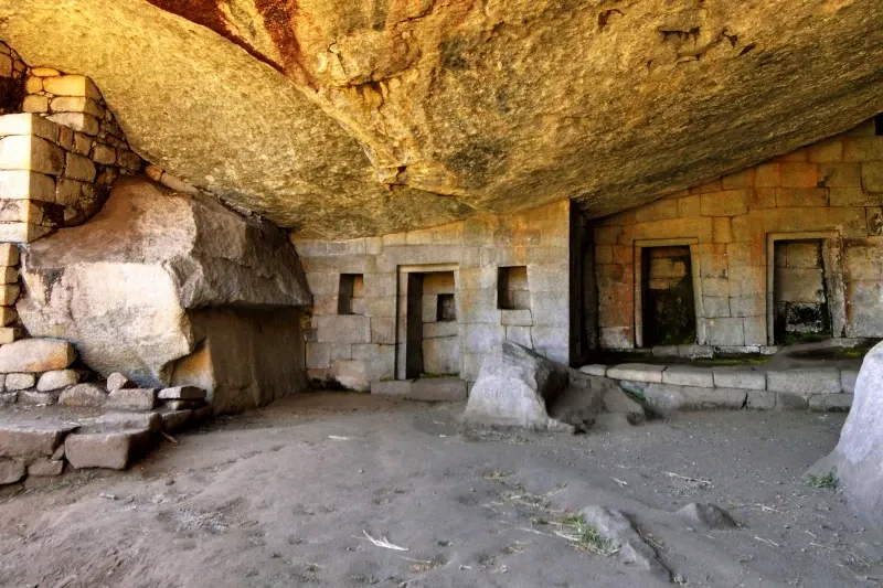 The intricate stone niches inside the Temple of the Moon, a hidden Incan cave temple on Huayna Picchu.