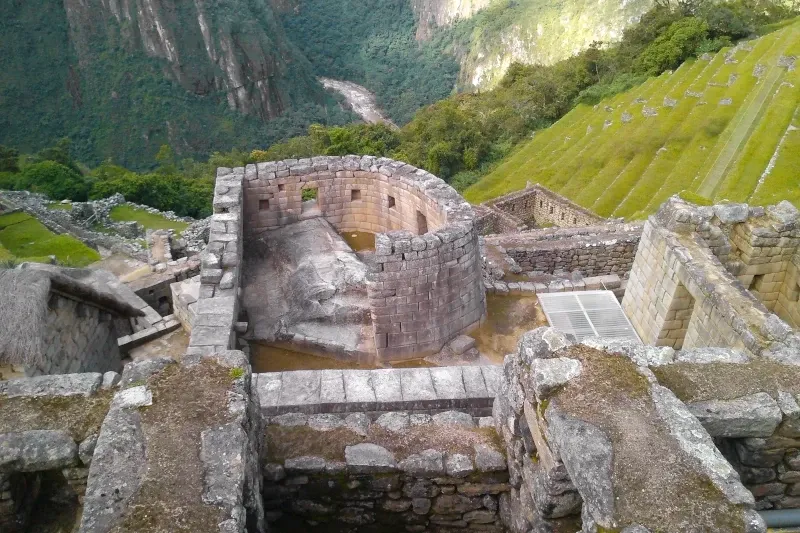 Sacred Sun Temple at Machu Picchu High angle view of the semi-circular Temple of the Sun and agricultural terraces overlooking the Urubamba Valley.