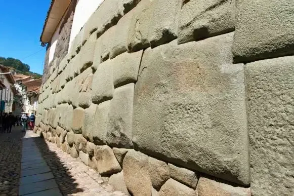 Close-up of the famous Twelve Angled Stone in a historic Inca wall in Cusco, Peru.